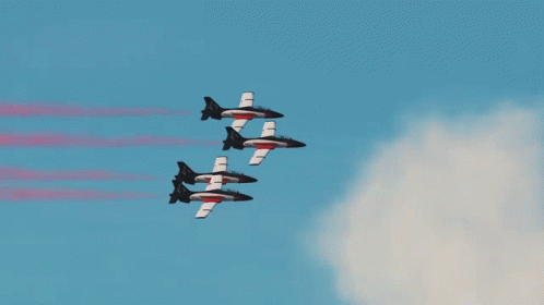 some military jets are flying in formation
