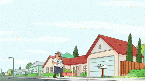 a man walking past a blue house with his back to the camera