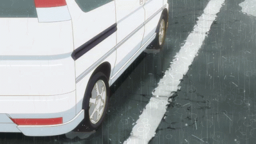a van parked in a parking lot in the rain