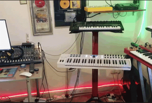 the music studio contains electronic equipment such as keyboards and keyboards