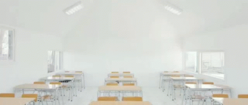an image of classroom setting with desks and chairs