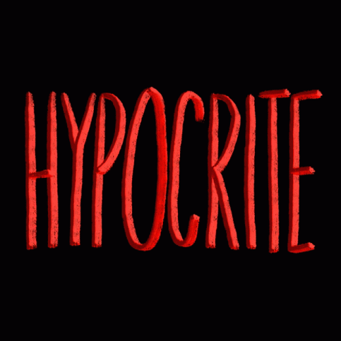 a person wearing a hat with the word hypocrite in blue