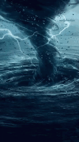 a storm rolls in over a dark ocean
