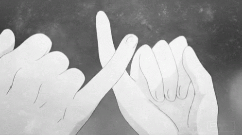a black and white image of two hands over each other with their fingers crossed
