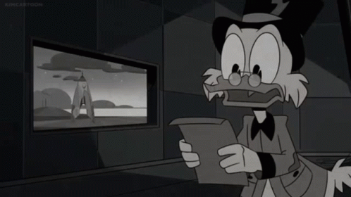 cartoon character with black hair in dark room looking at screen