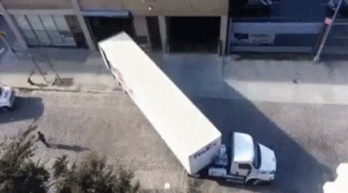 a semi truck crashed while being towed by a machine