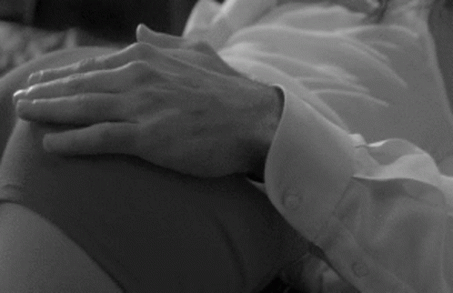 a close up of the hands and arm of an elderly woman