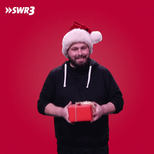 a man is holding an extra present with a blue background