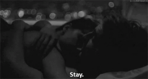 two people kissing each other with the words stay