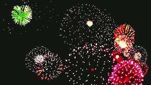 a dark room with a bunch of fireworks in the air
