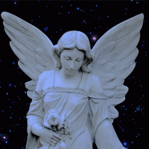 a little statue with white wings in front of some stars
