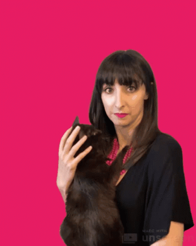 an animated po of a woman with dark hair holding a cat