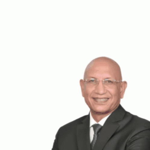 a man in a suit with glasses and a white background
