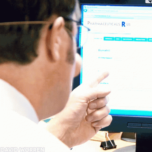 a man is looking at a medical form on the computer screen