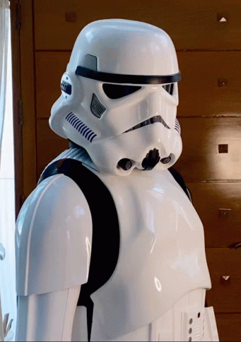 a close up of a storm trooper near some doors