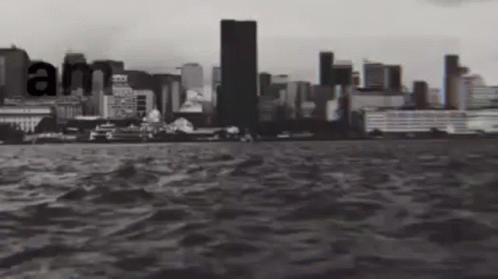 a boat traveling past the city skyline, with words floating on it