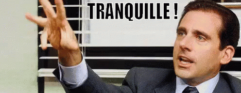 a man in a suit with a sign over his head that reads, tranoulie