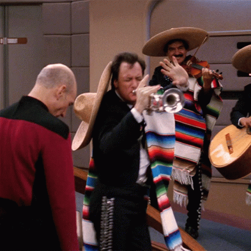 group of men dressed in mexican attire with instruments