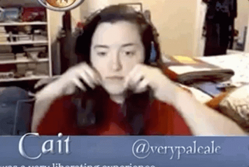 a woman with headphones is playing an interactive video game