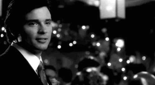 a man in a suit in front of some lights