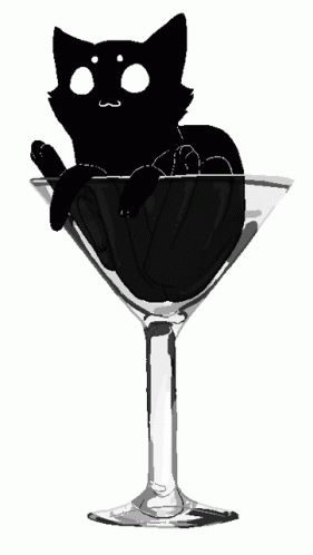 a black cat sitting in a martini glass