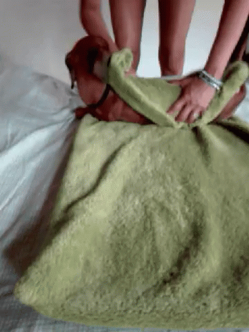 a person laying down with soing green and purple