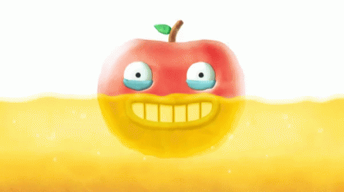an apple with a smile in the middle of water
