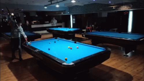 several people are playing pool and tennis