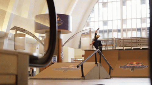 a mirror reflecting a person on a skate board