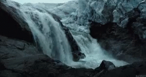 a waterfall is shown flowing into the water