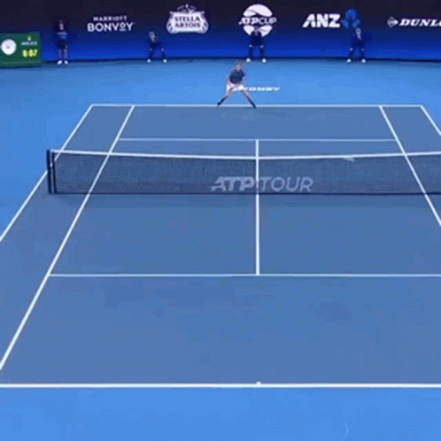 a man that is standing on a court with a racquet