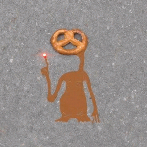 a person painted on the pavement holding a stick