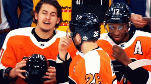 a hockey team is congratulated and laughing