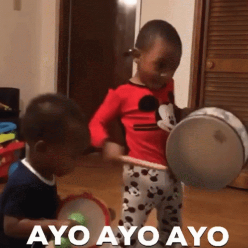 a group of children playing with toy drums