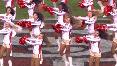 a large group of cheerleaders that are performing