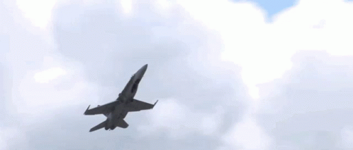 a fighter jet is flying through the sky