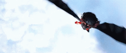 a black bat flying through the air on white paper