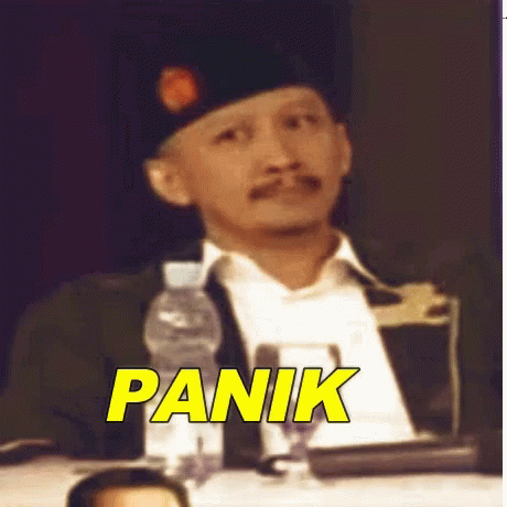 an image of a man with the caption panik