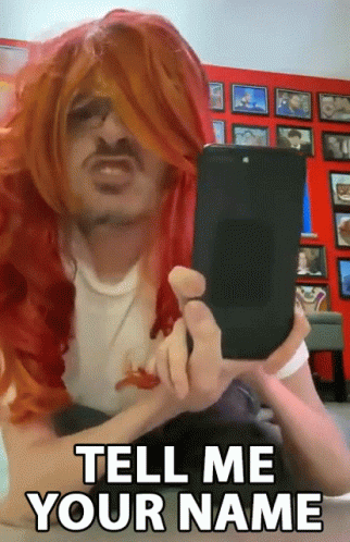 a person wearing wigs using a tablet