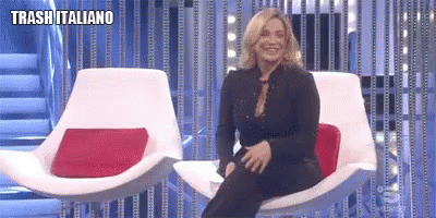 a woman sitting on a big chair on the television show, with a caption for traaliano