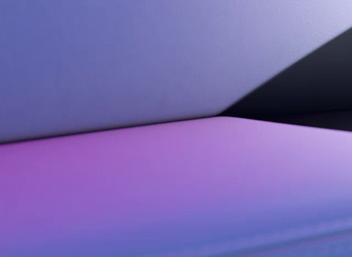 a close up view of a pink corner couch