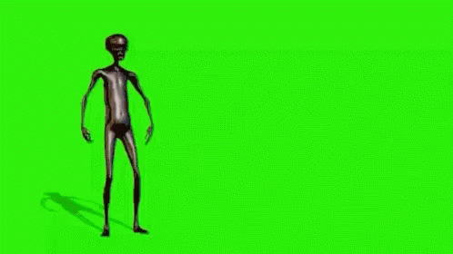 a stylized human figure standing in front of green screen