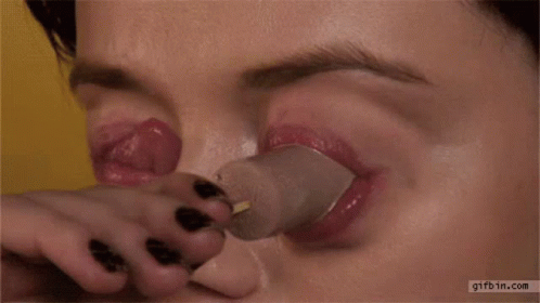 woman making sure she has had an injector applied to her nose