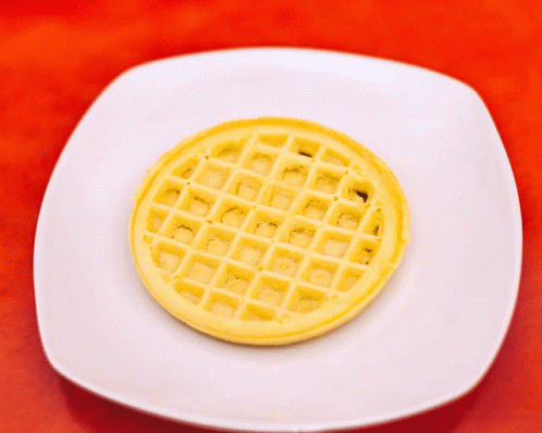 a waffle - like cake with a blue circle design on a white plate