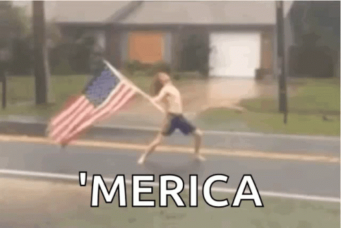 a picture of a boy holding an american flag