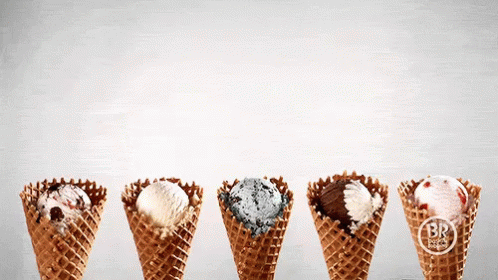 four ice cream cones have small designs on them