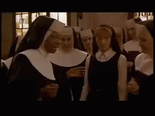 an old po shows several girls dressed in nun costumes