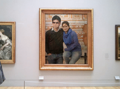 two framed pictures of people in a museum