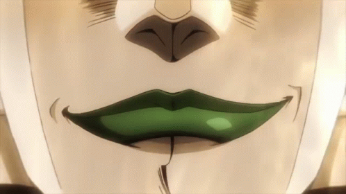 a green lip and mustache with white and grey paint