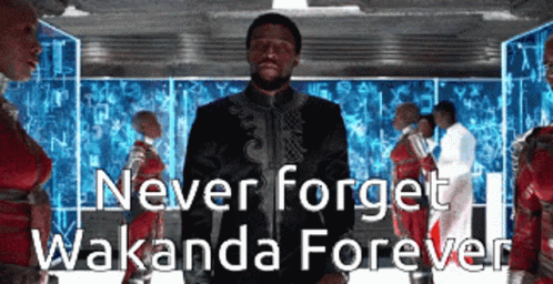 man wearing a black and white suit with text on it saying never forget wakanda forever